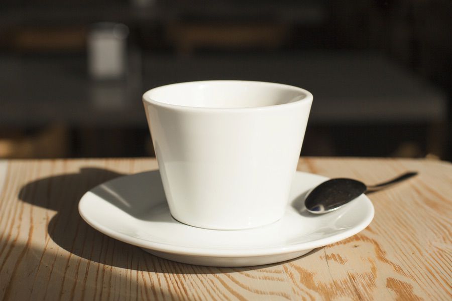 close-up-coffee-cup-spoon-desk