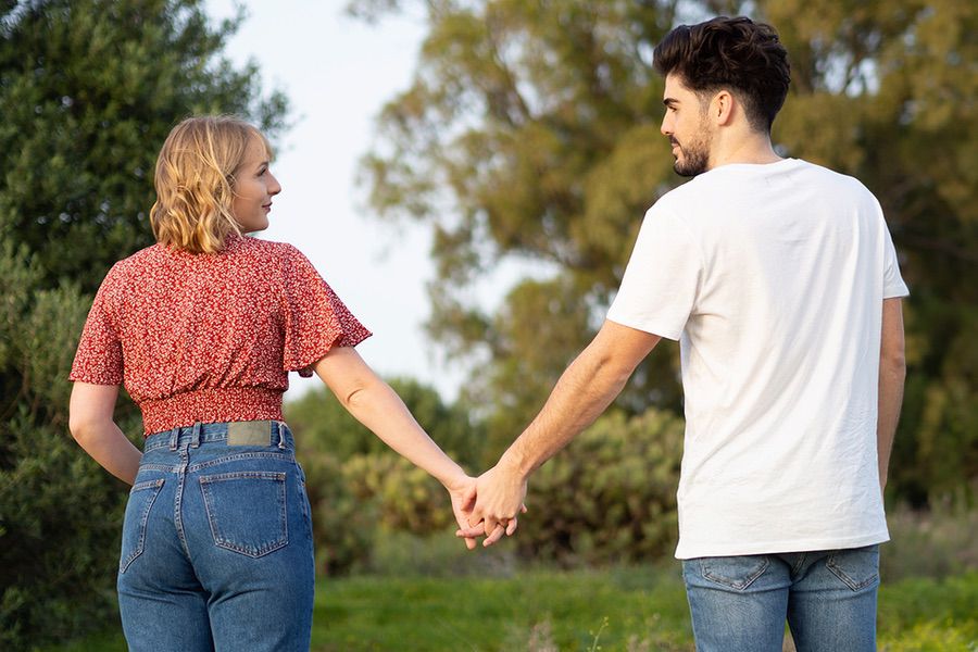 UPDATED back-view-of-a-cute-young-spanish-couple-holding-h-2023-11-27-05-15-01-utc-copy copy 2