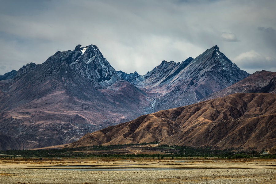 A beautiful scenery of rocky high mountains in Gongga County, Tibet, China